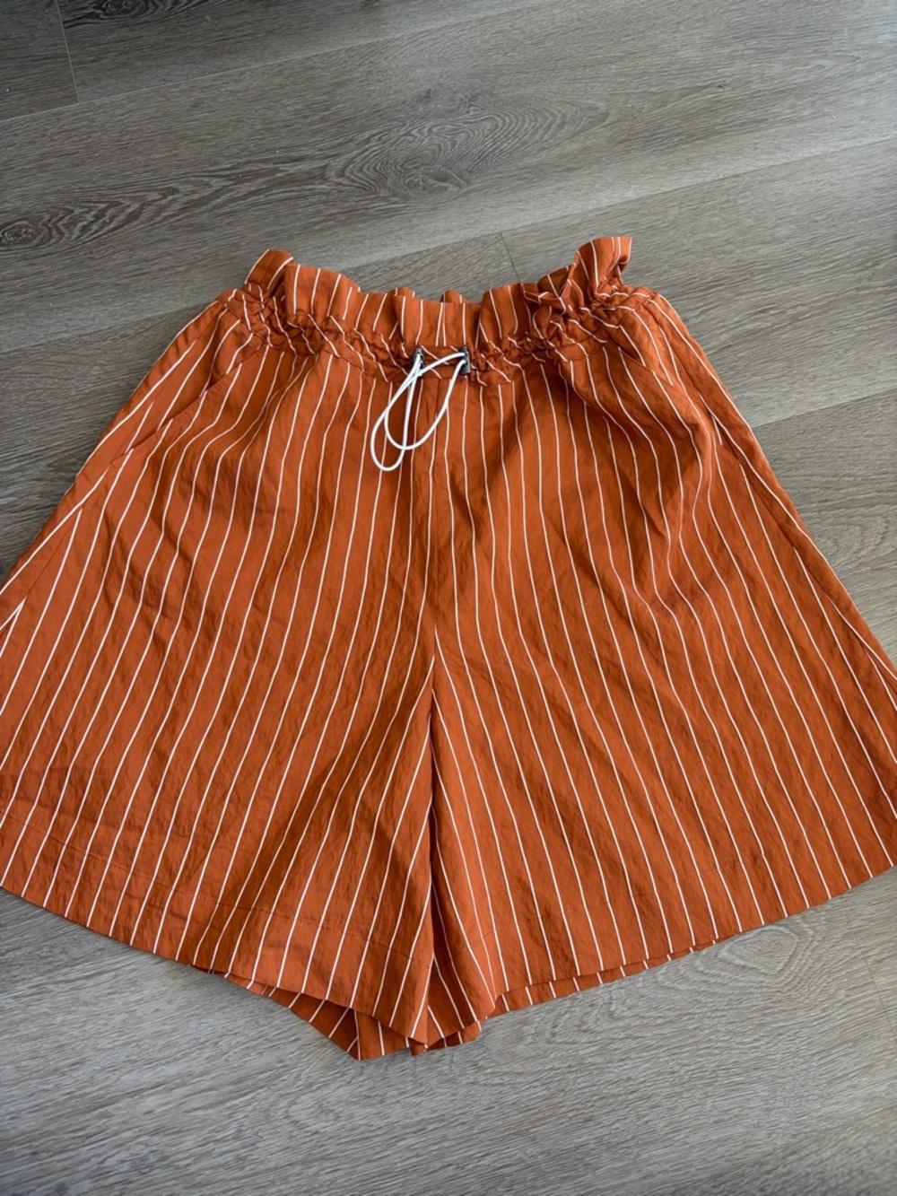 High-Waist Rust Stripe Paperbag Shorts in wear‎